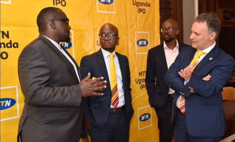 The MTN Uganda CEO, Wim Vanhelleptte (R) and Andrew Bugembe the MTN Uganda CFO (2L) on the sidelines of the Nairobi MTN IPO Investor meeting.