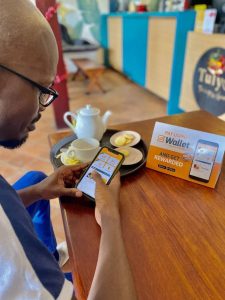 A customer making a cashless payment using the SafeBoda app wallet.