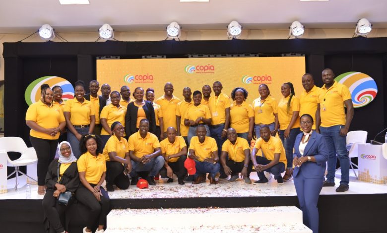 The Copia Global pose for a group photo during a breakfast reception held at Protea Hotel in Kampala, to celebrate their first year anniversary of operation in Uganda.
