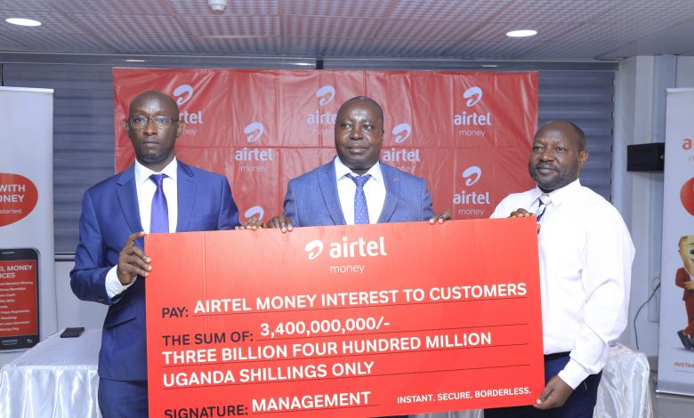 Mr. Japhet Aritho (C), Managing Director at AMCUL, David Birungi (L) PR Manager at Airtel Uganda, and Andrew Rugamba, Head of Ecosystems at AMCUL (R) during the announcement of the Airtel Mobile Commerce Uganda Limited payment of UGX3.4bn in first Interest payment to Airtel Money Customers.