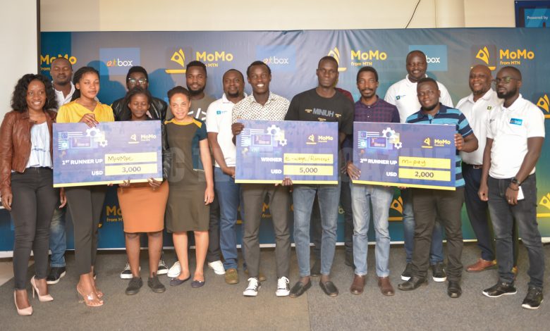 The winning teams, e-Wage, Mpa Mpe, and M-Pay pose for a group photo with the judges at the 2022 MTN MoMo Hackathon. (PHOTO: PC Tech Magazine)