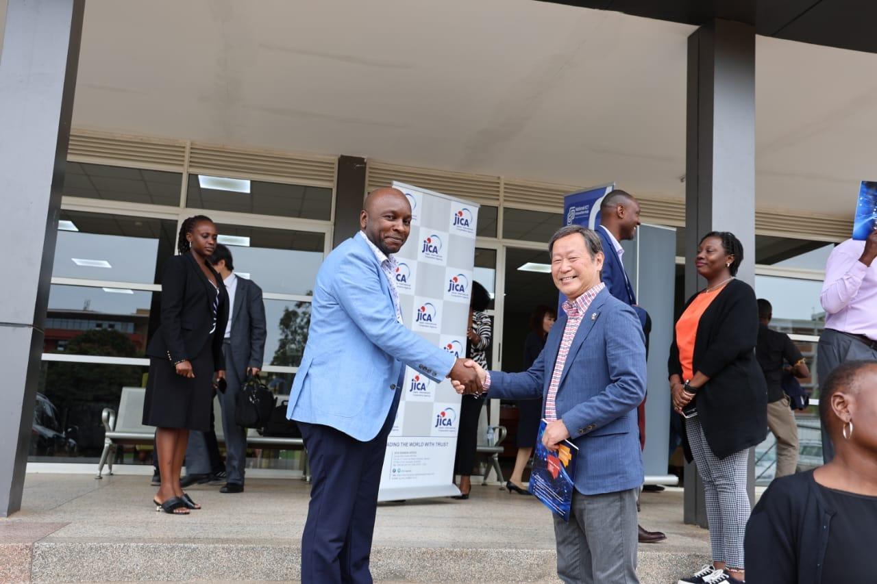 Executive Vice President of the Japan International Cooperation Agency (JICA), Dr. Junichi Yamada (right) and Cente-Tech Chief Technology Officer, Peter Kahiigi exchange pleasantries.