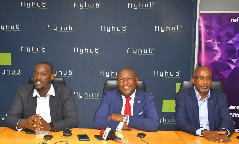 In Pictorial (L-R): Joel Muhumuza; FlyHub CEO, Andrew Mashanda; CEO Stanbic Uganda Holdings Ltd, and Michael Niyitegeka; Refactory Academy Programme Director settling in a press conference to brief the media on their partnership.