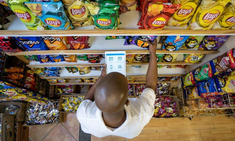 A man pictured using a tablet in a store while shopping. (COURTESY PHOTO)