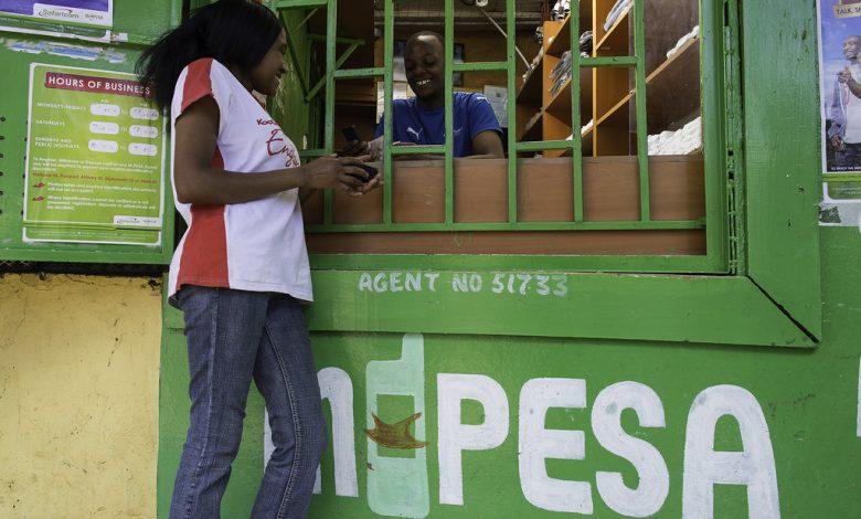 Safaricom: A customer pictured at an M-PESA stall. PHOTO: Philip Mostert