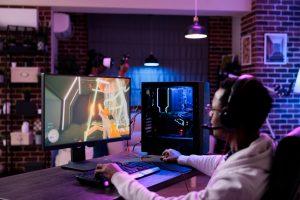 A gamer pictured playing a shoot out/action video game on his custom built gaming pc. PHOTO: DCStudio / Freepik