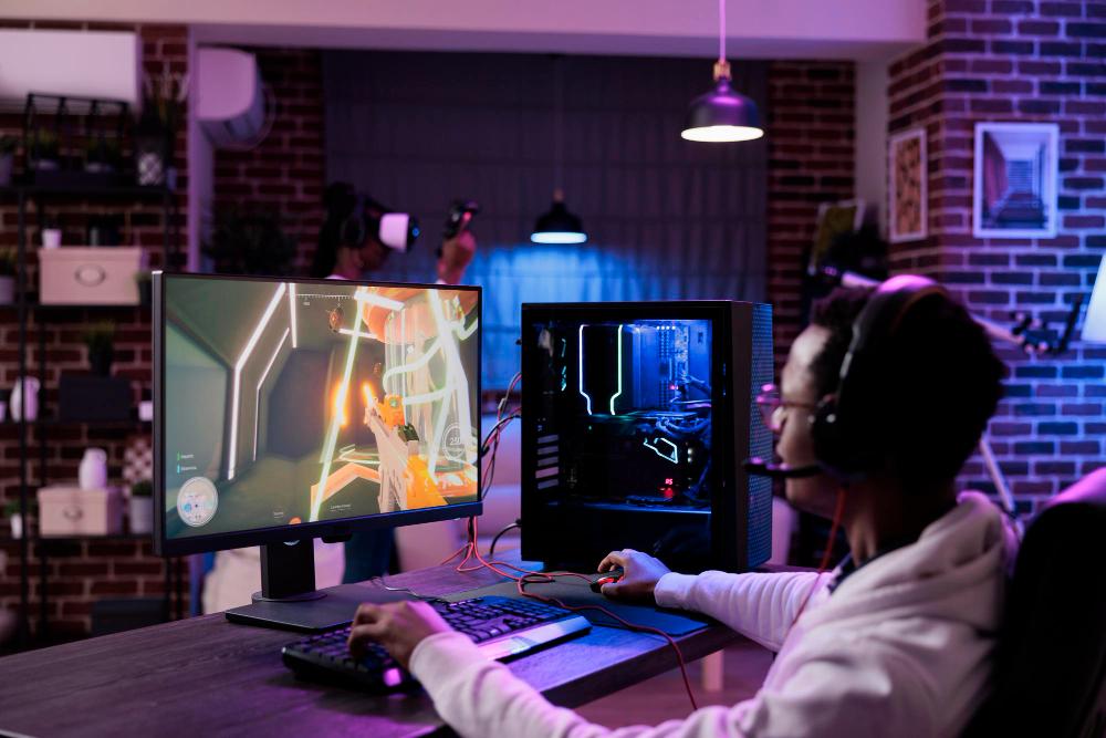 A gamer pictured playing a shoot out/action video game on his custom built gaming pc. PHOTO: DCStudio / Freepik