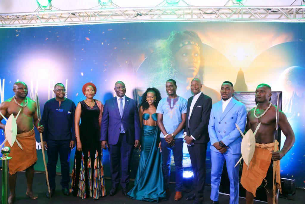 Some of the cast and crew of Nambi pose with Owek. Robert Nsibirwa the Deputy Katikiro (in suit) at the premiere of Nambi at Metroplex Cinema Naalya.