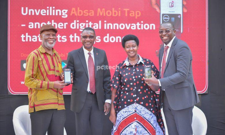 In Pictorial (left to right): Nnyanzi Nuwa; Vice Chairperson of NACCAU, Musa Jallow ; Absa's Retail Director, Robinah Mbabazi; Proprietor of Sprout Int'l, and Michael Segwaya; Absa's ED & CFO pose for a picture with Absa POS machines after launching the Mobi Tap. PHOTO: PC Tech Magazine