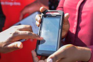 A merchant demonstrates using the Absa Mobi Tap device. PHOTO: PC Tech Magazine