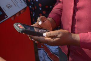 A merchant demonstrates using the Absa Mobi Tap device. PHOTO: PC Tech Magazine