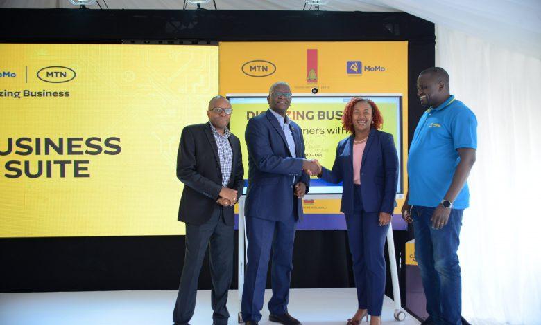 UBL Managing Director, Andrew Kilonzo and MTN CEO Sylvia Mulinge unveils FMCG Digital Suite in Kampala on Jukly 14. Looking on UBL Commercial Director, Ben Mbuvi (L) and MTN MoMo MD Richard Yego.