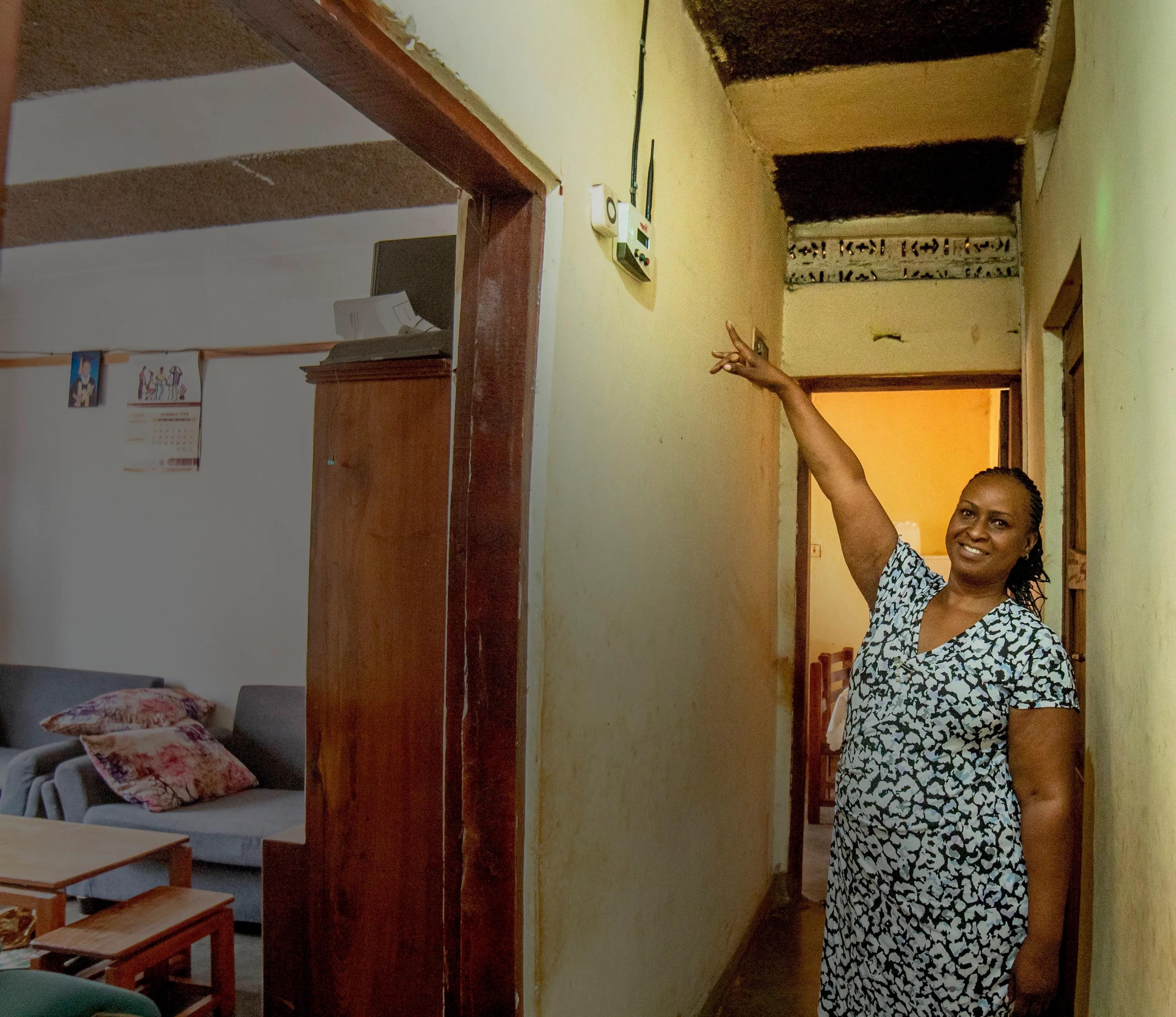 A house owner points at her YUNGA device insider her house. COURTESY PHOTO