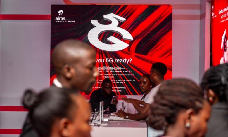 Guests at the unveiling of the Airtel Uganda's 5G network at Serena Hotel pass by an Airtel 5G display board in the background. PHOTO: PC Tech Magazine