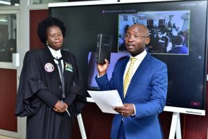 Alexander Kibandama takes oath as a new Board member of NITA-U.