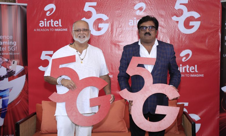 Manoj Murali (right), Airtel Uganda Managing Director, and Dr. Sudhir Ruparelia (left), the Proprietor of Speke Apartments pose for a photo with 5G placards after unveiling a second 5G site at Speke Apartments in Kampala. COURTESY PHOTO