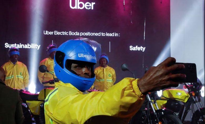 An Uber boda boda rider takes a selfie after the launch of the company's first fleet of electric product in Nairobi, Kenya, August 31, 2023. REUTERS/Monicah Mwangi
