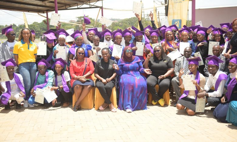 70 girls graduate under the esteemed MTN Girls in Tech program pose for a group photo with Enid Edroma, General Manager, of Corporate Services at MTN Uganda and Jamila Mayanja, CEO of Smart Girls Foundation.