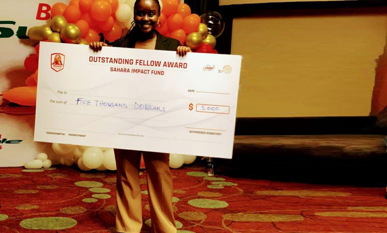 Shifra Ainomugisha, founder of SOLAFAM Uganda a dummy cheque of USD$5,000 (Sahara Impact Fund) after emerging as an outstanding fellow award at SIPA 2023. COUNTRY PHOTO