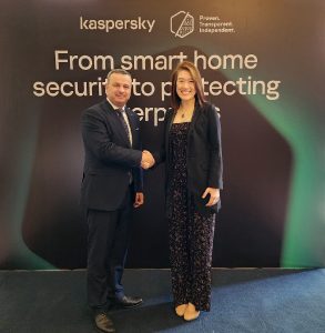Daas Omar; Senior Cybercrime Officer at AFRIPOL, and Genie Sugene Gan; Head of Government Affairs and Public Policy for Asia-Pacific, Japan, Middle East, Türkiye and Africa regions at Kaspersky shake hands after opening the transparency centre.
