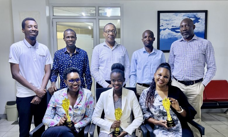 Part of the Media Age team pose for a group photo with the agency's won accolades. PHOTO: TBWA Uganda