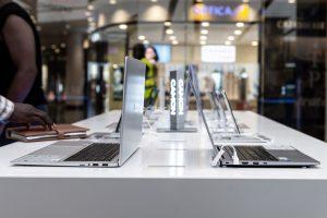 A display of a sample of Tecno laptops along with Tecno Camon series smartphones. PHOTO: Olupot Nathan Ernest / PC Tech Magazine