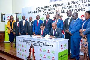Airtel Uganda's Managing Director, Soumendra Sahu (left) and K2 Telecom's Managing Director, Arthur Mawanda (right) signing an MoUs to renew their partnership while Charles Peter Mayiga (center in the back), the Katikkiro of Buganda and other officials from the Buganda Kingdom, Airtel Uganda, and K2 Telecom look on. Courtesy Photo