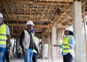 Centenary Group’s Group Company Secretary & General Counsel; Brenda Magoba (right) talking to one of the site engineers of Centenary Group’s state-of-the-art Tier 3 Green Data Centre. PHOTO: Kulu Erick