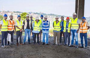 Centenary Group Chairman, Prof. John Ddumba-Ssentamu (in blue vest) and a delegation of executives from Centenary Group and Centenary Technology Services, and site engineers pose for a group photo. PHOTO: Kulu Erick