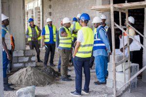 Centenary Technology Services’ Chief Technology Officer; Peter Kahiigi (center) briefing Centenary Group Chairman, Prof. John Ddumba-Ssentamu (right in blue vest) and a delegation of executives from Centenary Group and Centenary Technology Services at the construction site of Centenary Group’s state-of-the-art Tier 3 Green Data Centre. PHOTO: Kulu Erick