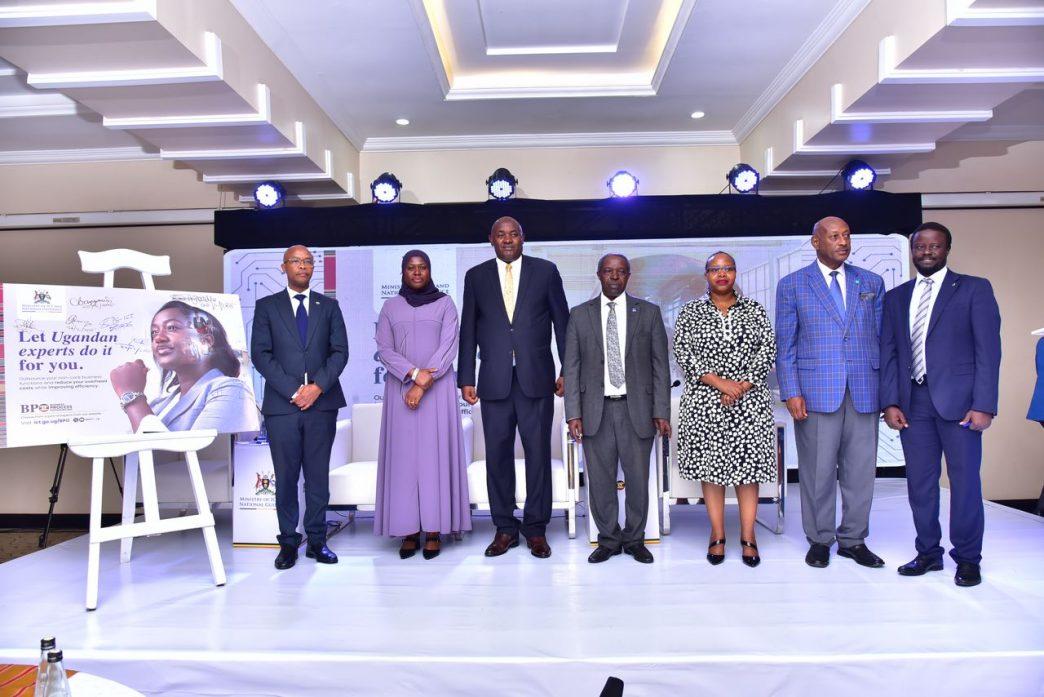 (L-R): Ambrose Ruyooka, Commissioner of Research and Development at the Ministry of ICT and National Guidance, Permanent Secretary for the Ministry of ICT and National Guidance, Dr. Aminah Zawedde, Minister for ICT and National Guidance, Hon. Dr. Chris Baryomunsi, Prof. William Bazeyo (centre), Chairman of the BPO Council, and other officials pose for a group photo after the launch of the National Business Process Outsourcing (BPO) Policy and Publicity Campaign at Mestil Hotel. PHOTO: Ministry of ICT