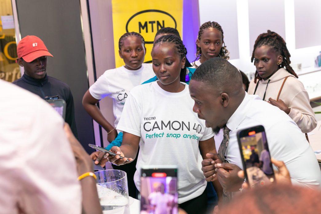 An usher pictured wearing a Camon 40 branded t-shirt during the launch of the series in Uganda. PHOTO: TECNO