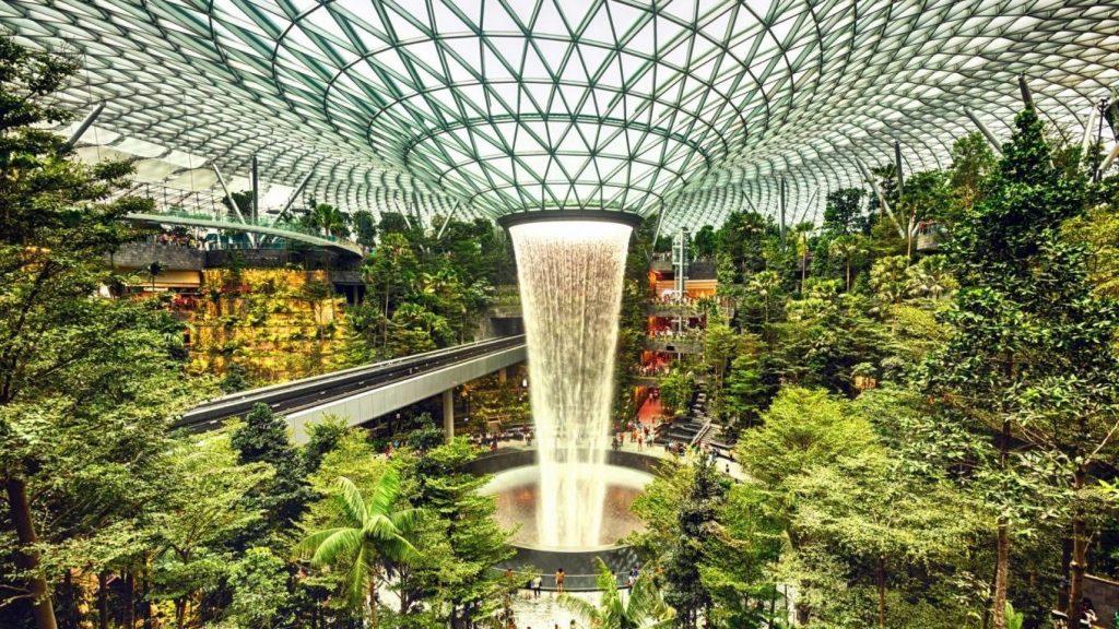 Singapore, Jewel Changi Airport, a mixed-use development by architect Moshie Safdie including gardens, a hotel, aviation facilities, a shopping mall and a 40 meter indoor waterfall, the world's largest | Photographer: John Seaton Callahan / Getty Images