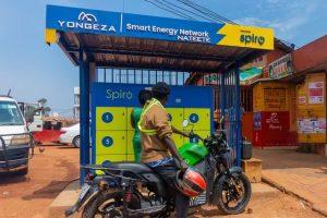 A motorcycle rider stops at a Yongeza spiro battery swap station. COURTESY PHOTO