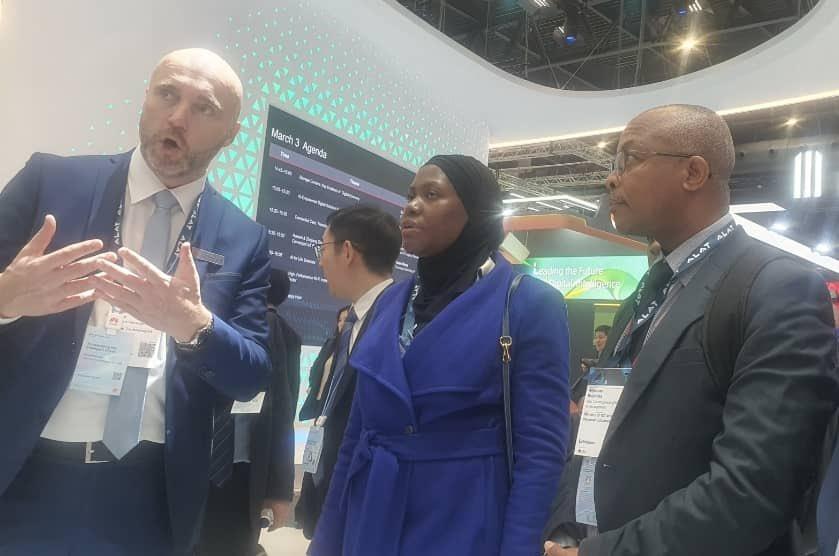 Permanent Secretary at the Ministry of ICT and National Guidance, Dr. Aminah Zawedde (centre) and Assistant Commissioner of Research and Development at the Ministry of ICT and National Guidance, Ambrose Ruyooka (right) at MWC Barcelona 2025. COURTESY PHOTO