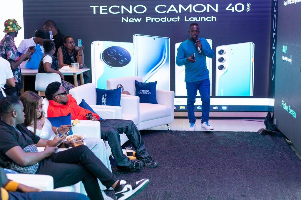 Bruce Dickson, Product Consultant at TECNO Uganda makes a presentation about the Camon 40 series at the launch on Thursday at Arena Mall in Kampala. PHOTO: TECNO