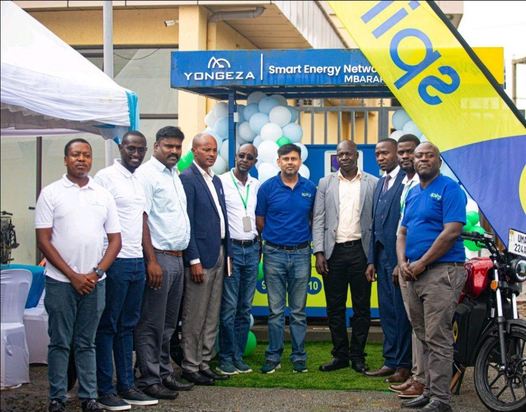 Nelson Tashobya (1st from left), Collin Mugisha (5th from left), and Gaurav Anand-Country Head of Spiro (5th from right), and other members from Yongeza and Spiro pose for a photo at the launch of a battery swap station in Mbarara. PHOTO: Jean Ruth Komugisha