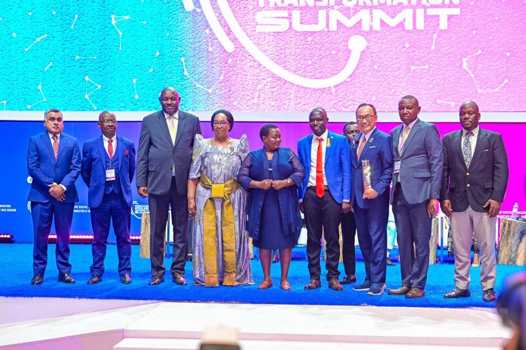 Rt. Hon. Robinah Nabbanja (5th from right), Dr. Hon. Chris Baryomunsi, and Hon. Joyce Nabbosa Ssebugwawo pose with other delegates at the launch of the first-ever Middle East & Africa Digital Transformation Summit.