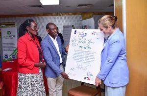 Grace Labong Achire (left), Vice Chair ATIS, and Patrick Kagenda, Chairman of ATIS (center) handing a 'Thank You' pluckcard to H.E. Frederieke Quispel, Ambassador of the Kingdom of the Netherlands to Uganda, during the handover of the NTF program to ATIS on Friday, May 30, 2025 at Hotel Africana. PHOTO: Kulu Erick