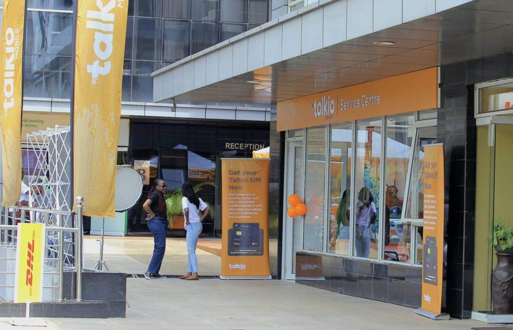 Pictured some guests standing next to the newly opened Talkio Mobile's service centre at Ntinda Complex. COURTESY PHOTO