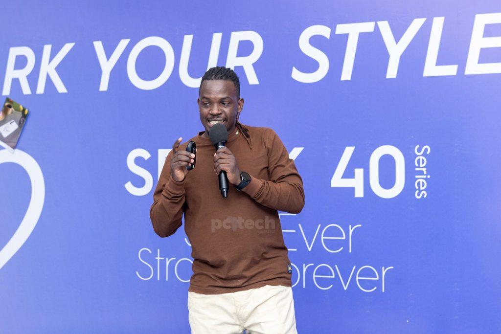 Bruce Dickson, Product Consultant at Tecno Mobile Uganda, speaking at the experiential event at Arena Mall, Nsambya. PHOTO: PC Tech Magazine