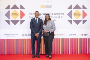 Reginald Tumusiime (L) and Edline Murungi (R) at the 2025 Kampala Blockchain Summit at Four Points by Sheraton. COURTESY PHOTO