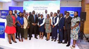 Representatives from Stanbic Bank Uganda and Fincom Technologies pose for a group photo after announcing their partnership to deliver the first fully digital lending solution for schools in the country. COURTESY PHOTO