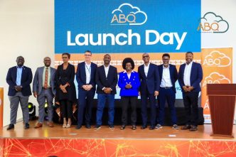 Hon. Monica Musenero,(5th R), Minister of Science, Technology and Innovation poses for a group photo with other partners from ABQ Cloud, Raxio, Roke Telkom, and Industry 4.0+ Bureau at the launch of ABQ Cloud. COURTESY PHOTO