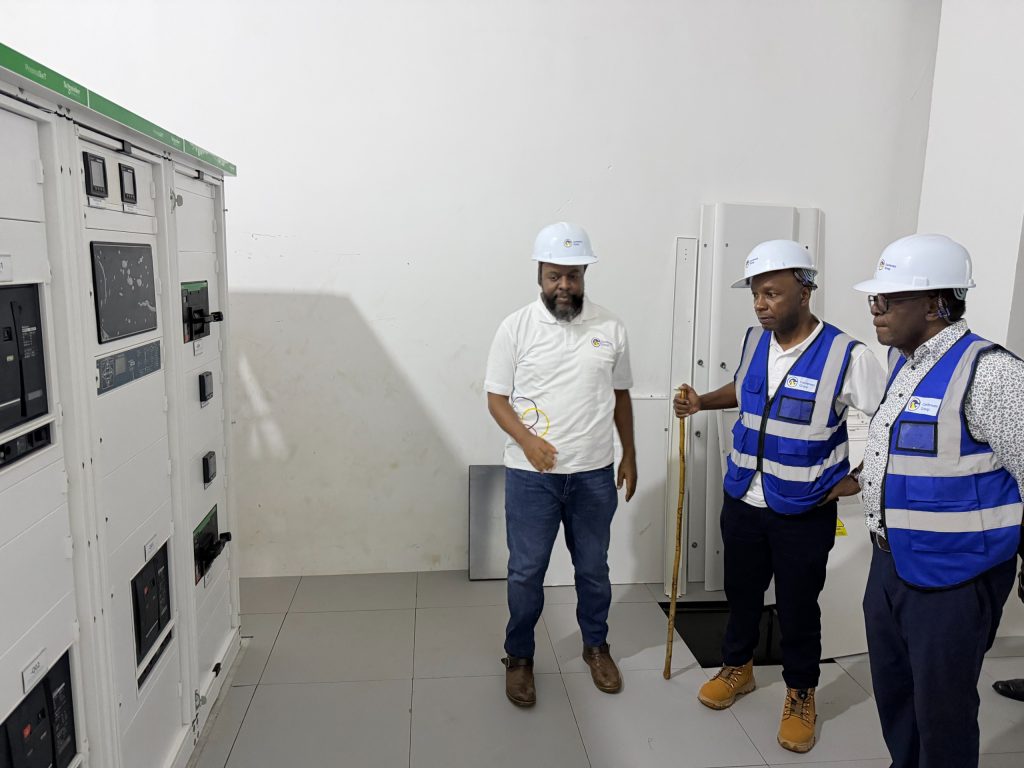 Prof. John Ddumba-Ssentamu (right), Executive Chairman, Centenary Group, and Peter Kahiigi (centre), CTO at Centenary Technology Services with a contractor inside the yet to be launched Centenary Group's Data Centre in Masaka. COURTESY PHOTO