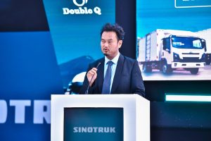 Sinotruk's Product Manager, Kobe Xiao, speaking at the launch of the Sinotruk 4-tonne box body truck at the Source of the Nile Hotel in Jinja. PHOTO: ZedShots