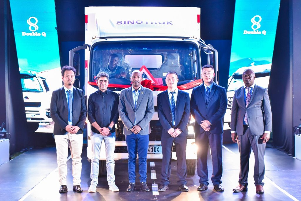 The Resident City Commissioner (3rd from left) for Jinja City, poses for a group photo with officials from Double Q and Sinotruk after the unveiling of the Sinotruk 4-tonne. PHOTO: ZedShots