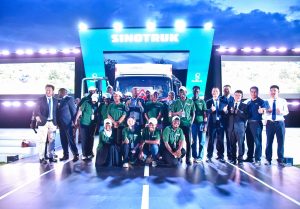 The Resident City Commissioner (3rd from left) for Jinja City, poses with the marketing and sales team from Double Q and Sinotruk after the unveiling of the Sinotruk 4-tonne. PHOTO: ZedShots