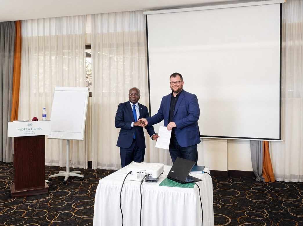 Dr. James Onyoin (left), Board Chairperson and founding member of Vision Africa AI and Carols Parker (right), Head of AI Programs at Arxia, shake hands after signing an MoU. PHOTO: PC Tech Magazine