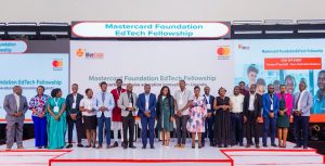 The 12 selected venture founders pose for a group photo with mentors, organizers of the Mastercard EdTech Fellowship, officials from the Ministry of Education & Sports, and other guests.